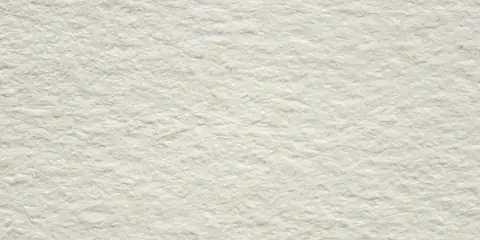 Nahaufnahme einer hellen Vliestapete mit feiner, gleichmäßiger Oberfläche